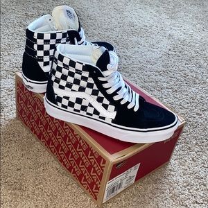 Checkerboard Vans sneakers